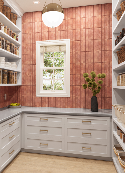 Walk-in pantry with red-pink rectangle backsplash tile and white cabinets and shelves.