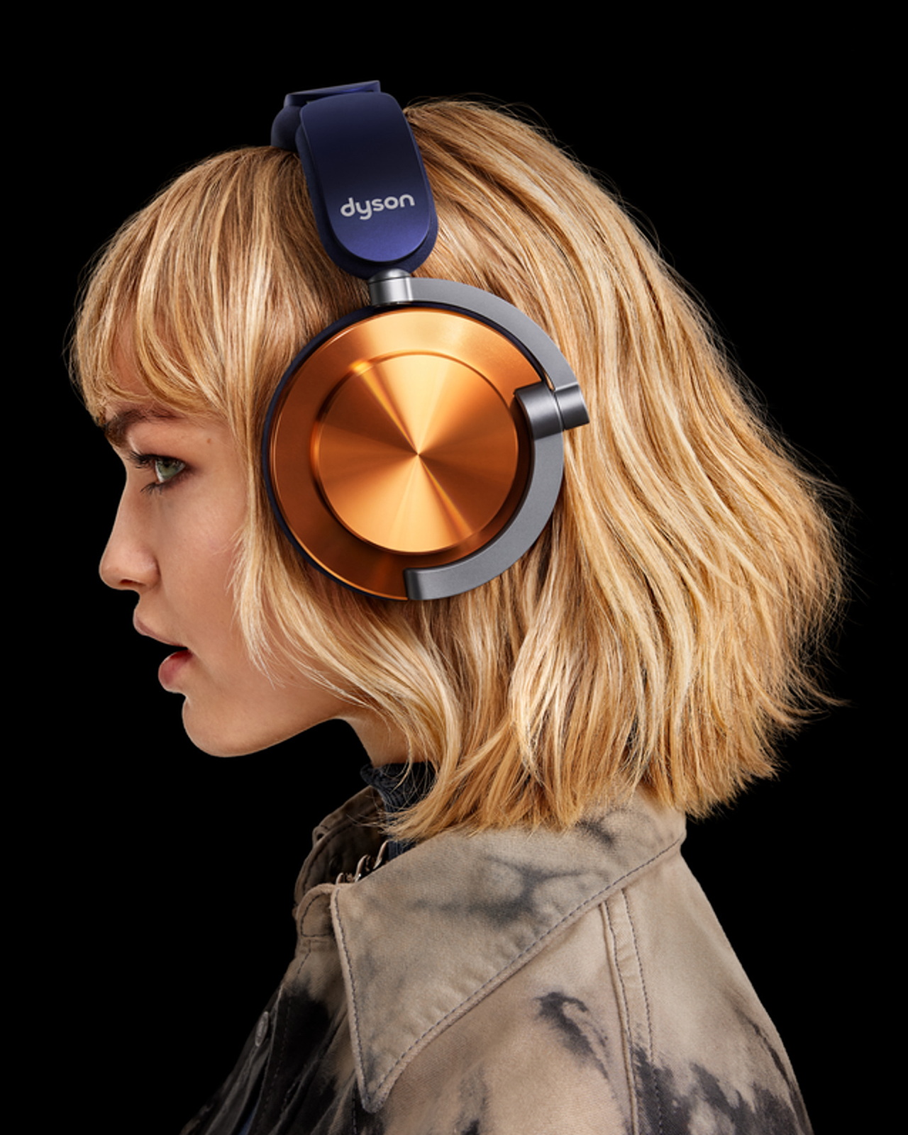 A model wearing Dyson OnTrac headphones.