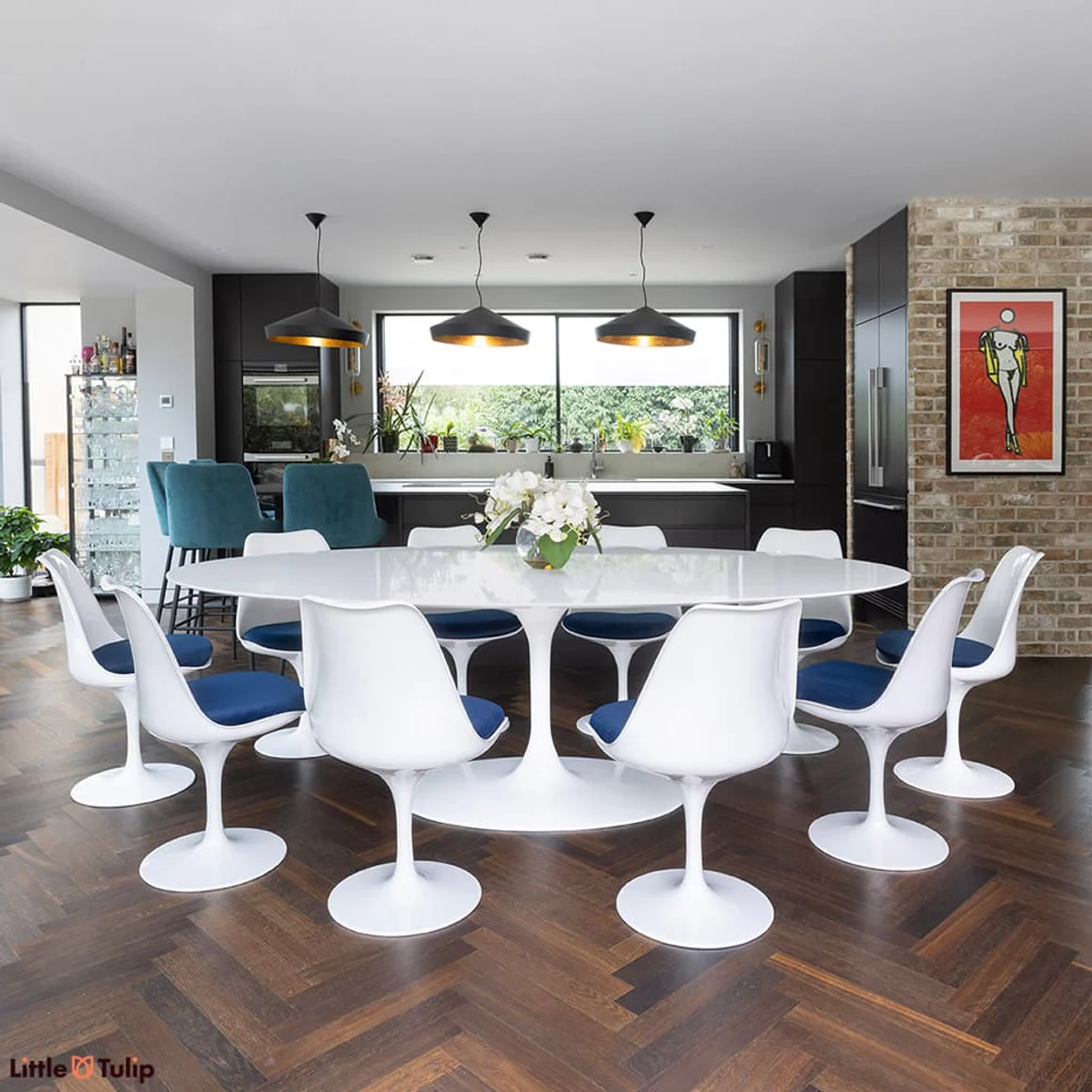Side on view of white laminate 244 table with 10 side chair bluse cushion