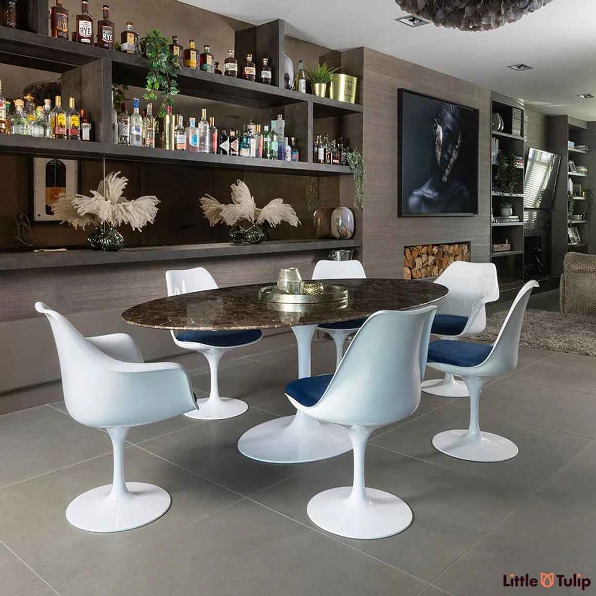 Angled view of 200 Emperador table with 4 sides, 2 arms blue cushion