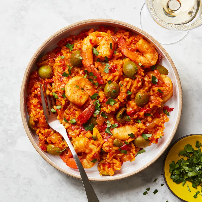 A plate of Shrimp and Rice made with Cacciatore Sauce.