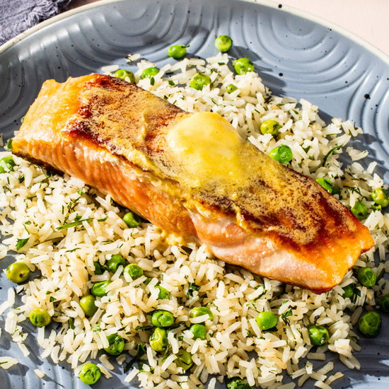 Dijon-Butter Salmon with Herbed Rice And Peas 