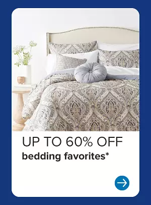 Image of a bed. Up to 60% off bedding favorites.