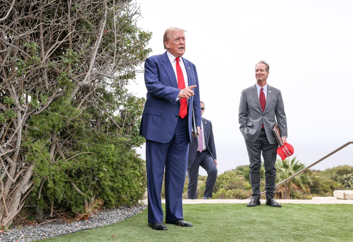 Donald Trump stands outdoors speaking to reporters at his golf course in Rancho Palos Verdes in September.