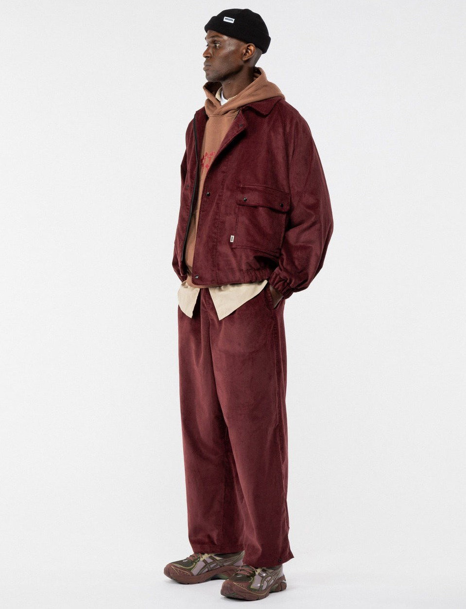 Person wearing berry cord