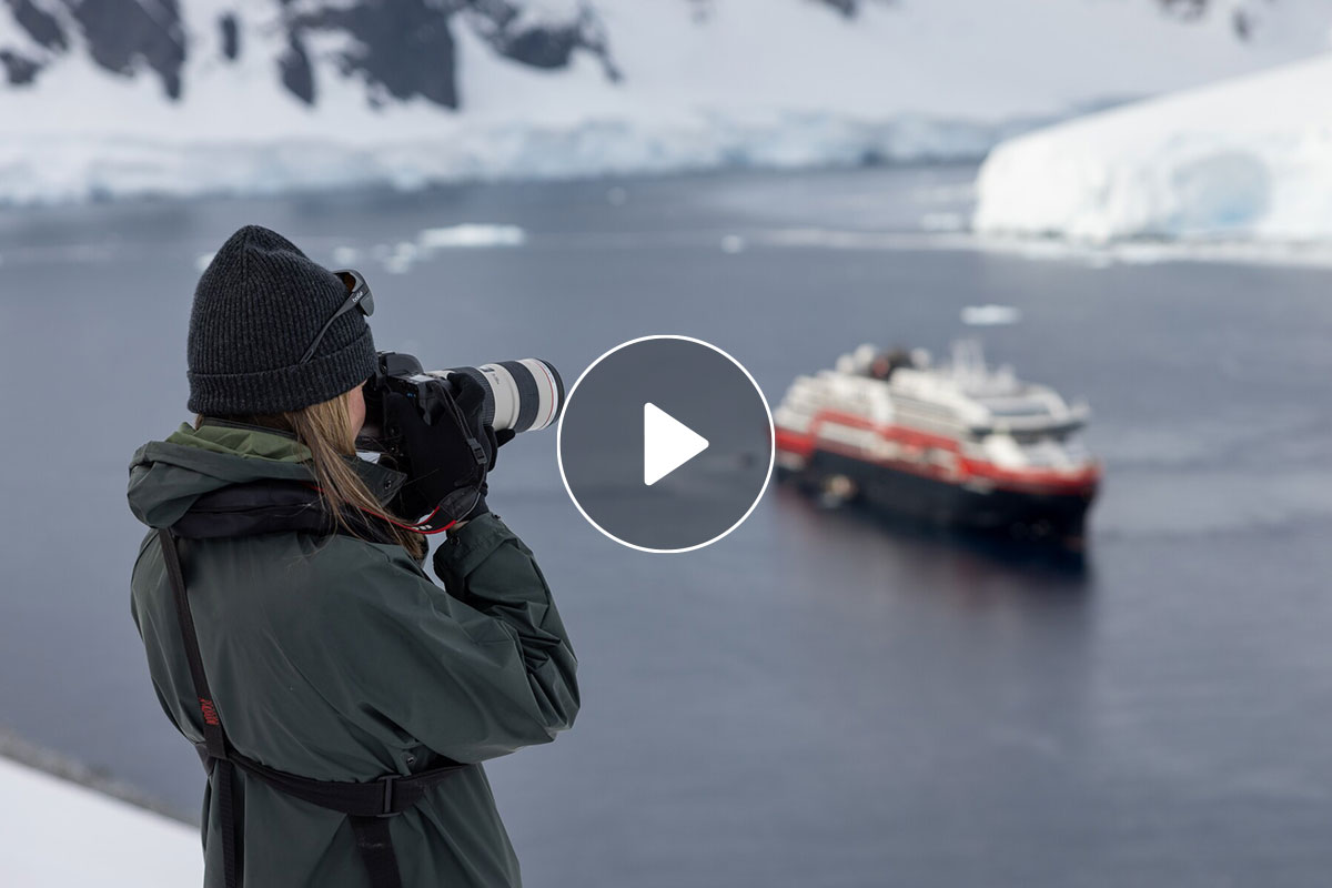 A guest takes photos in Antarctica