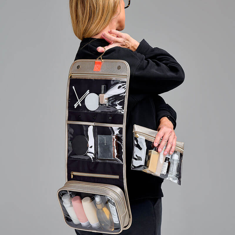 Large hanging wash bag in gold with multiple compartments