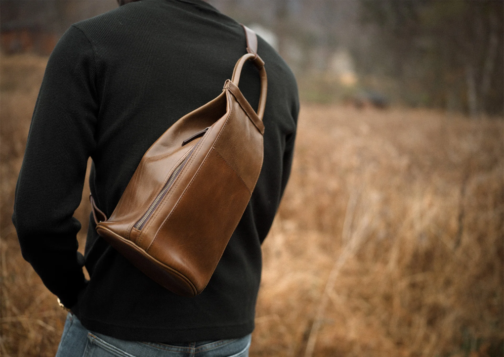 man standing outside with Garment Bag