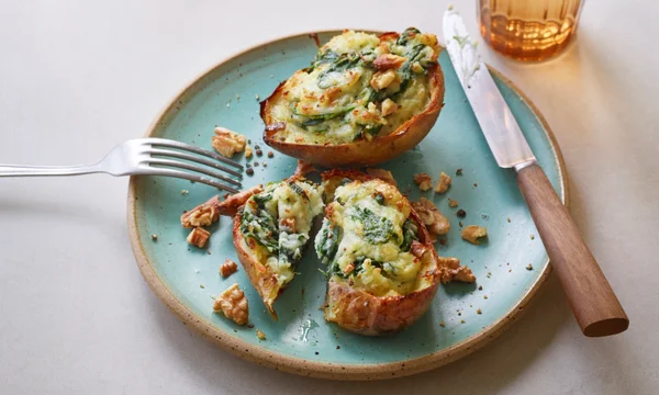 Yotam Ottolenghi’s spinach- and gorgonzola-stuffed jacket potatoes.