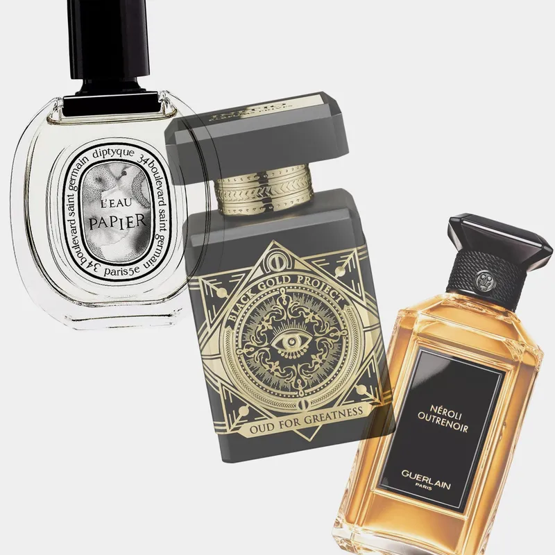 Collage of winter perfumes on grey background including the products Diptyque L'Eau Papier Eau de Toilette, Guerlain, and Initio Oud for Greatness Eau de Parfum