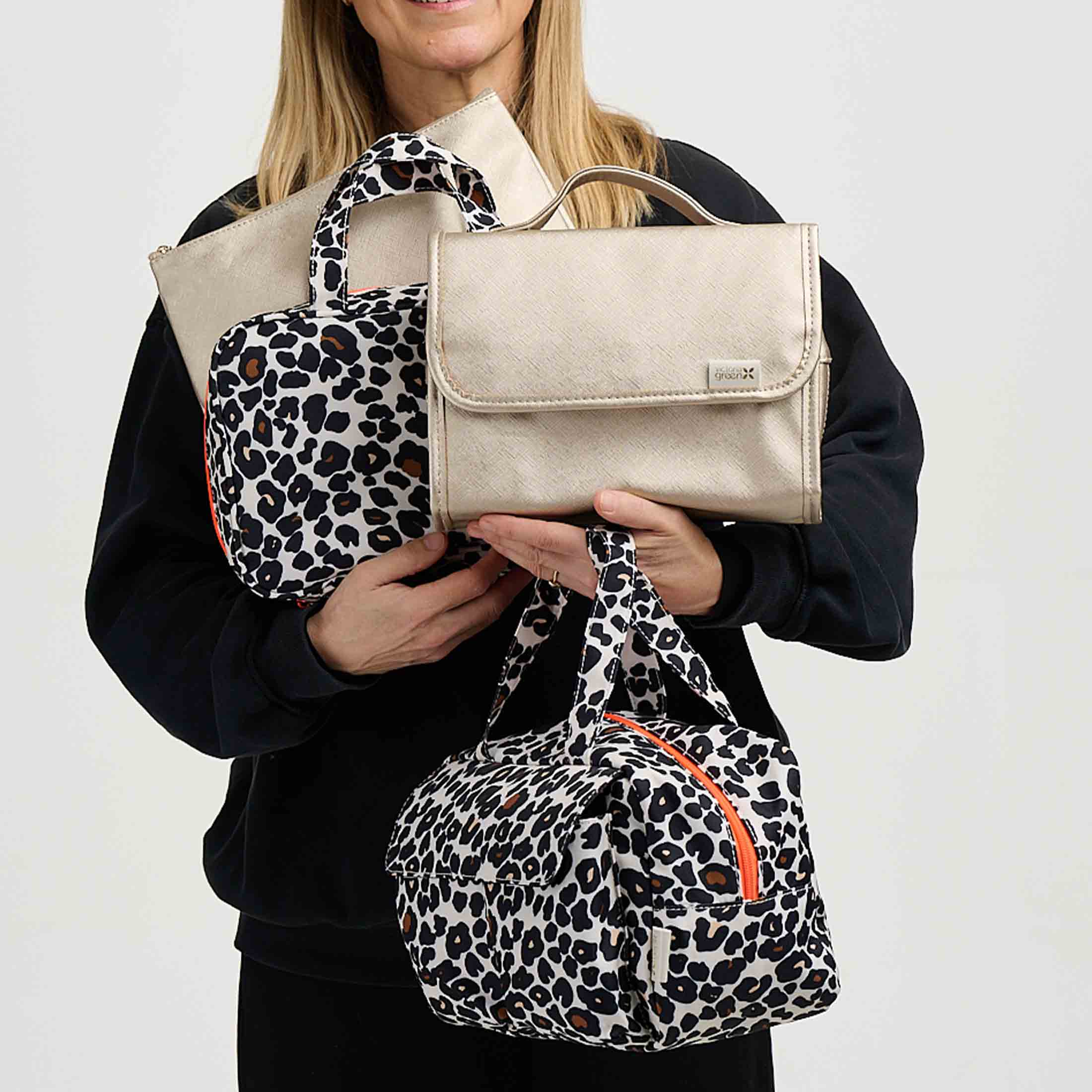 Woman holding wash bags and makeup bags