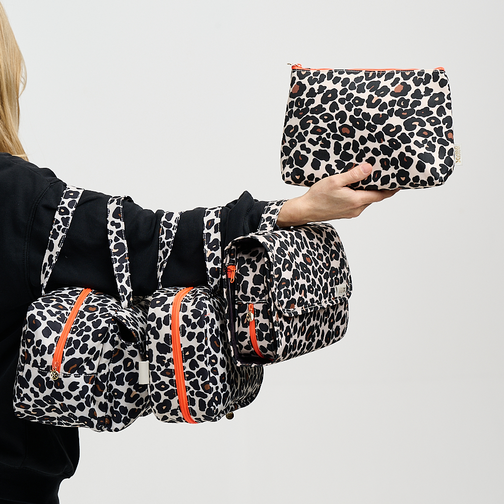 A group of leopard print wash bags