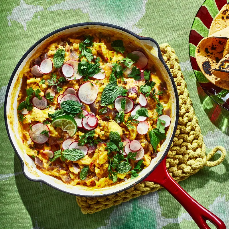 Masala Skillet Scramble served in a skillet with side of tortillas. 