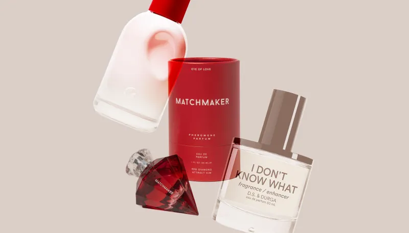 Varying perfume bottles scattered on a beige background