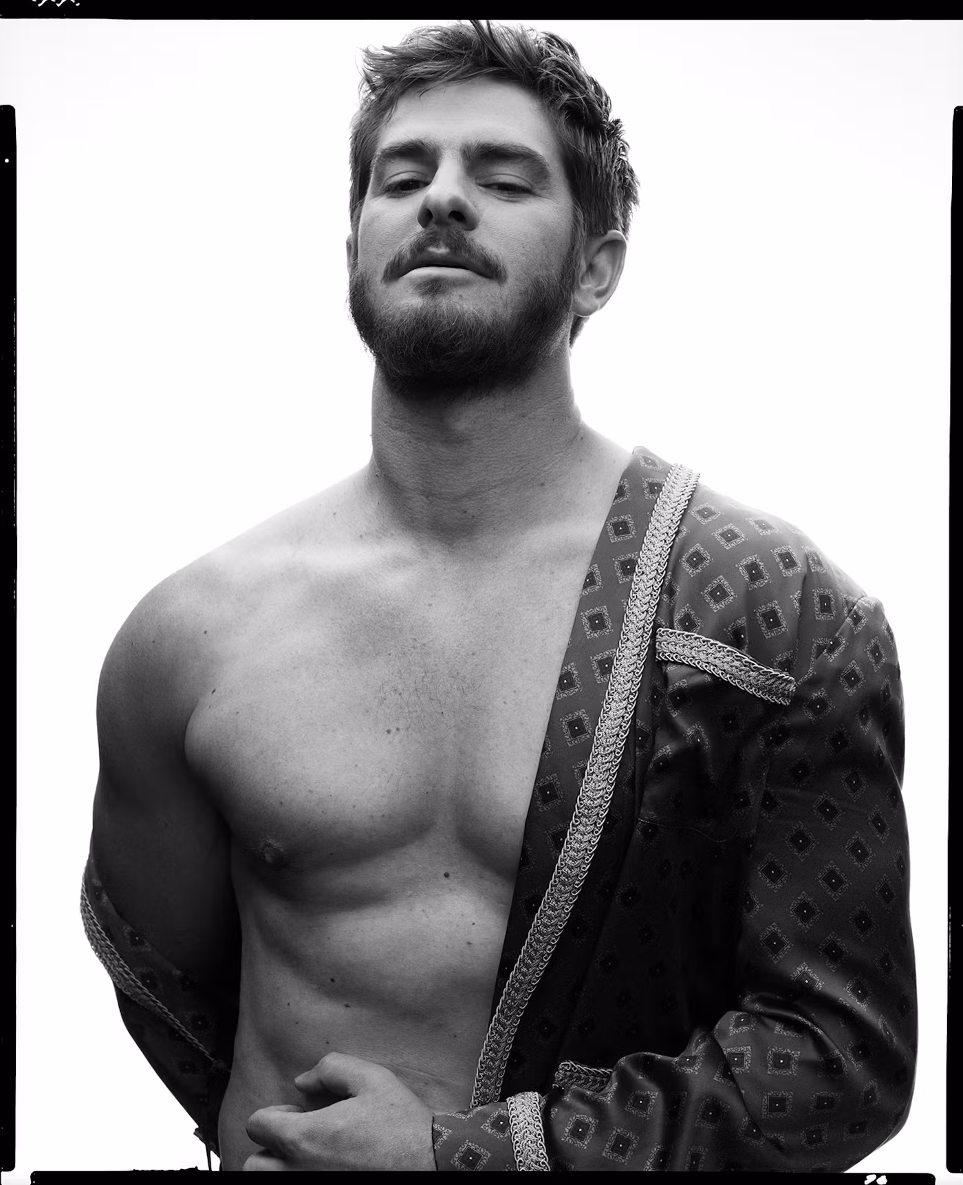 Andrew Garfield wears a Celine Homme by Hedi Slimane robe.