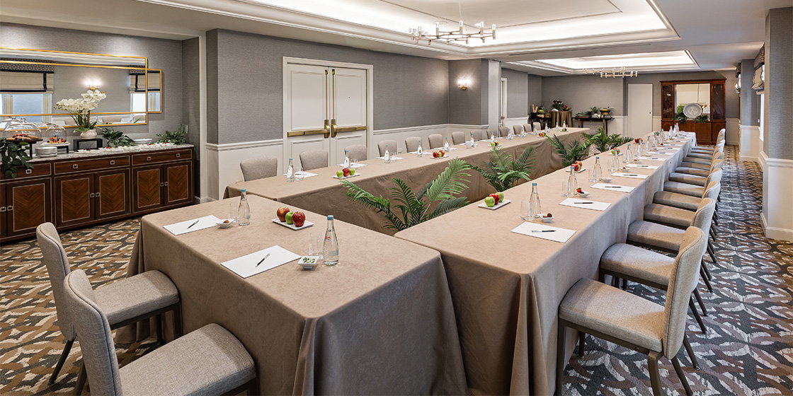 a long conference room with tables and chairs