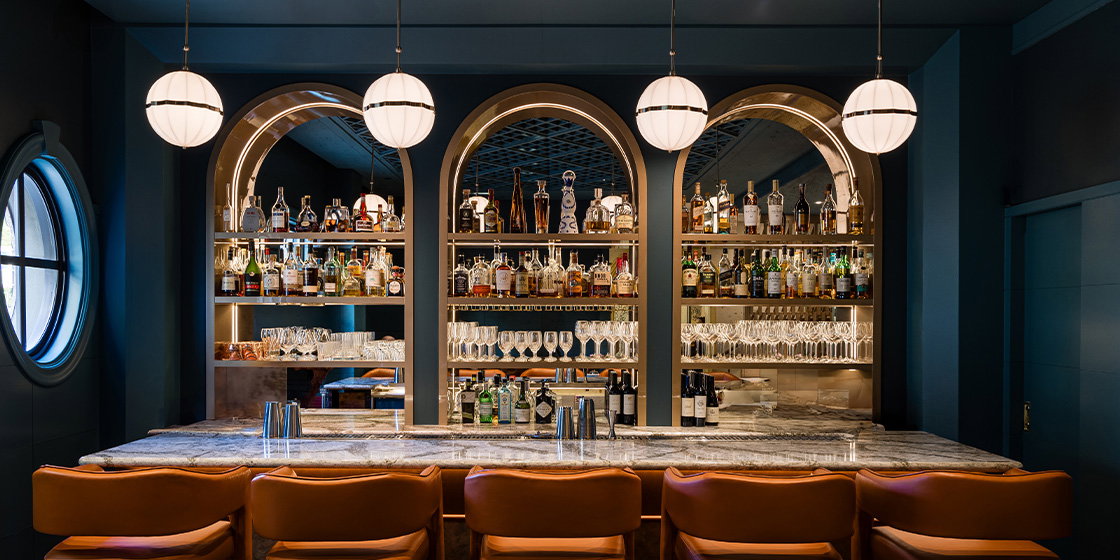 a bar with bottles and glasses