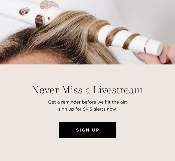 A woman's hair is being curled with a white and rose gold styling tool, alongside a graphic promoting SMS alerts for livestream reminders.