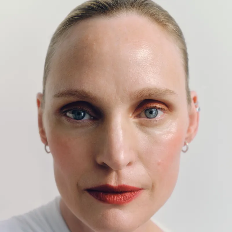 Image may contain: Face, Head, Person, Photography, Portrait, Adult, Body Part, Neck, Cosmetics, Lipstick, and Skin