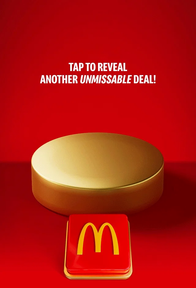 An empty gold plinth sits on a red background with a big red button beneath it. Text reads TAP TO REVEAL ANOTHER UNMISSABLE DEAL