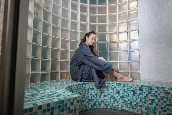 woman relaxing in celtic thermal suite pod