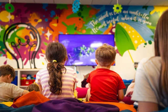 children enjoying a movie at film and fun night