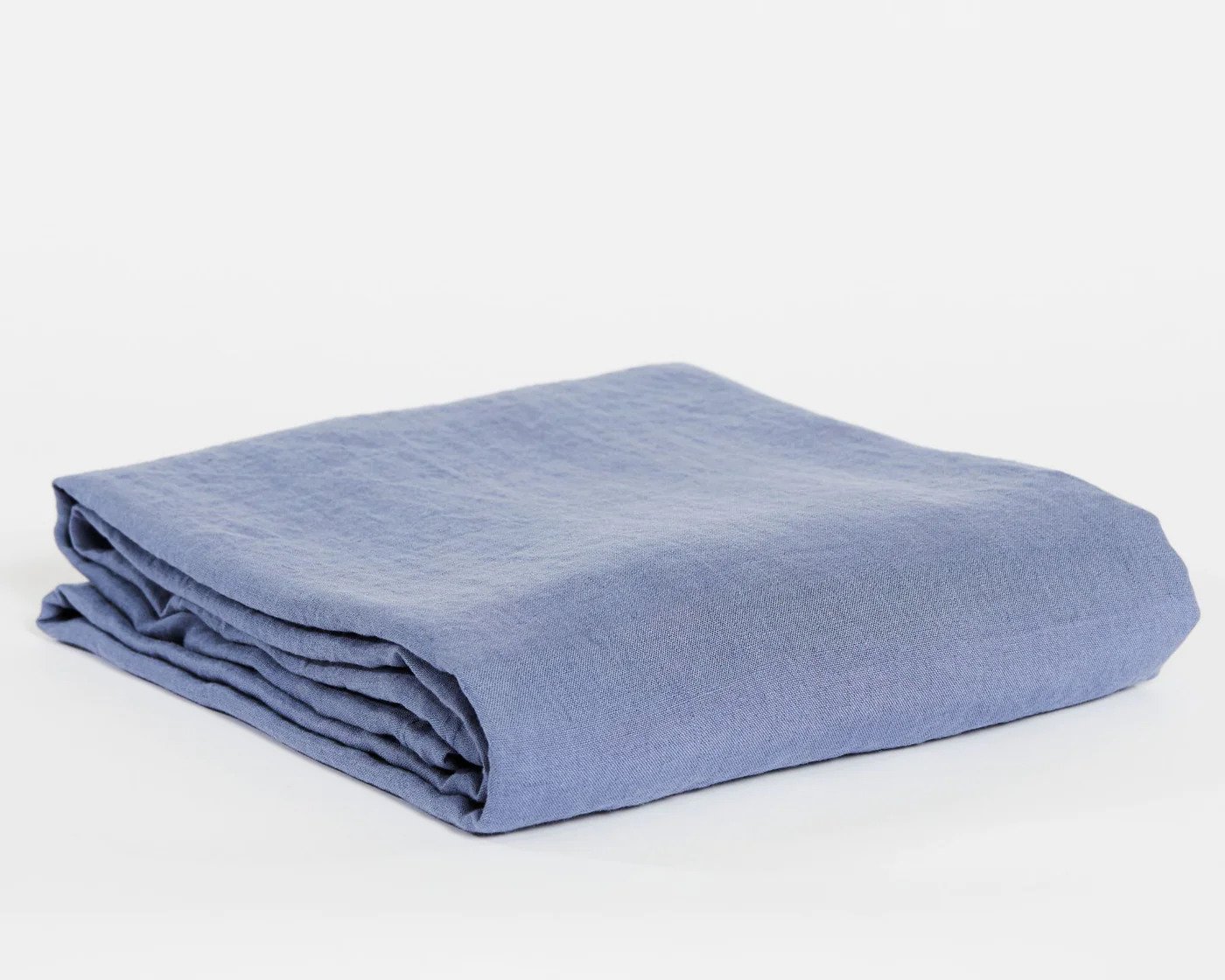 Neatly folded organic linen top sheet