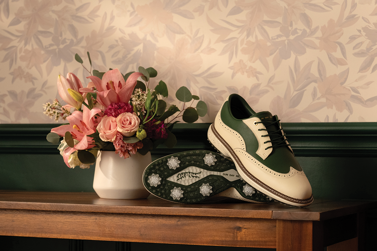 The Pioneer Magnolia Azalea Gold LE shoes stacked on a wooden table with Azalea Flowers