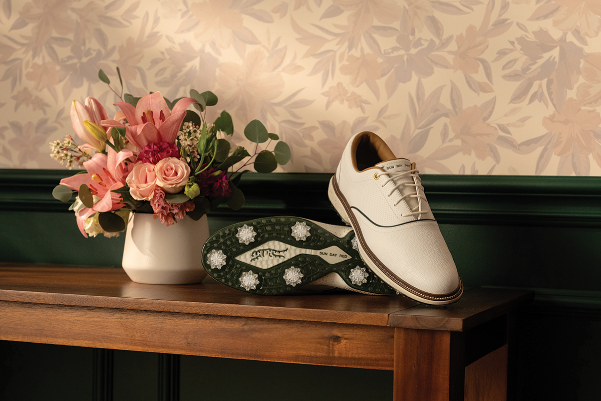 The Pioneer Cypress Azalea Gold LE shoes stacked on a wooden table with Azalea Flowers