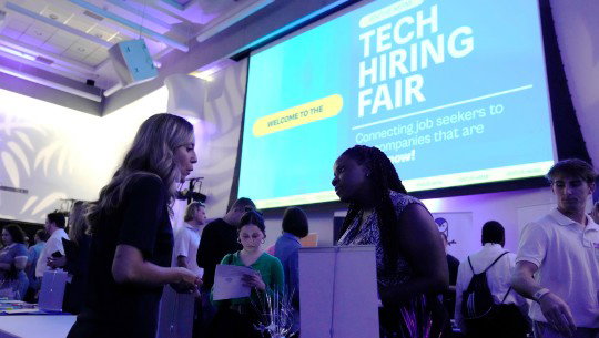 Attendees at a tech hiring fair