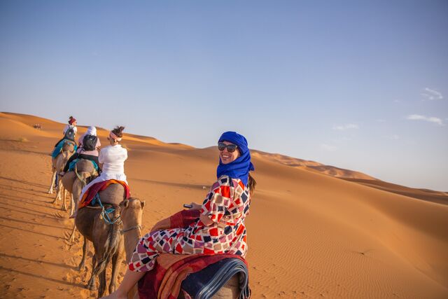 Ride a camel in the desert in Morocco