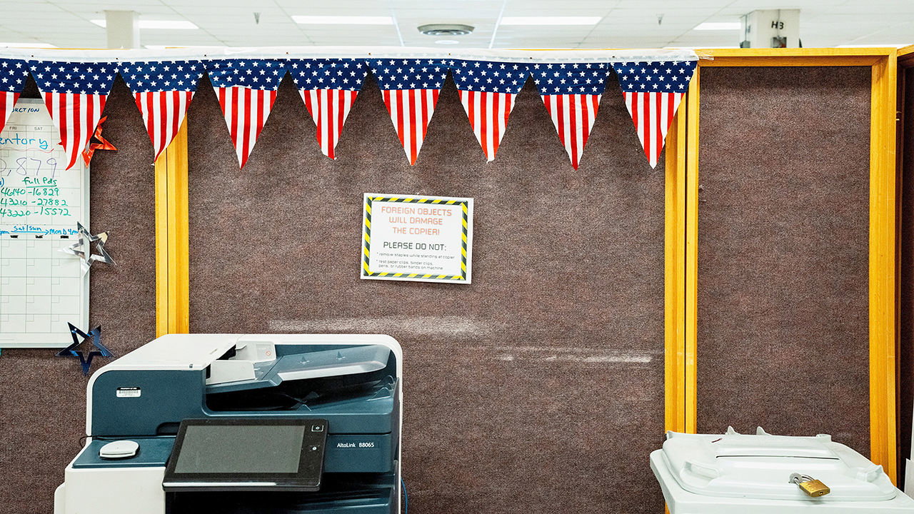 American flag bunting hangs above a photocopier at the Internal Revenue Service campus in Austin, Texas, US.