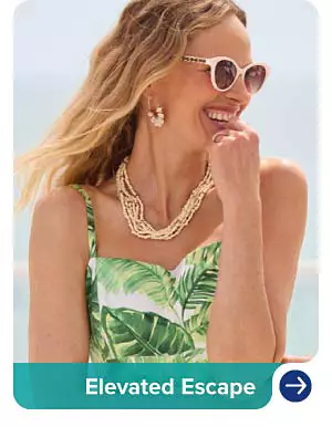 Image of a woman wearing sunglasses and gold tone drop earrings. Elevated escape.