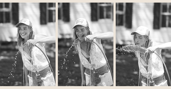 Girl drinking from a hose