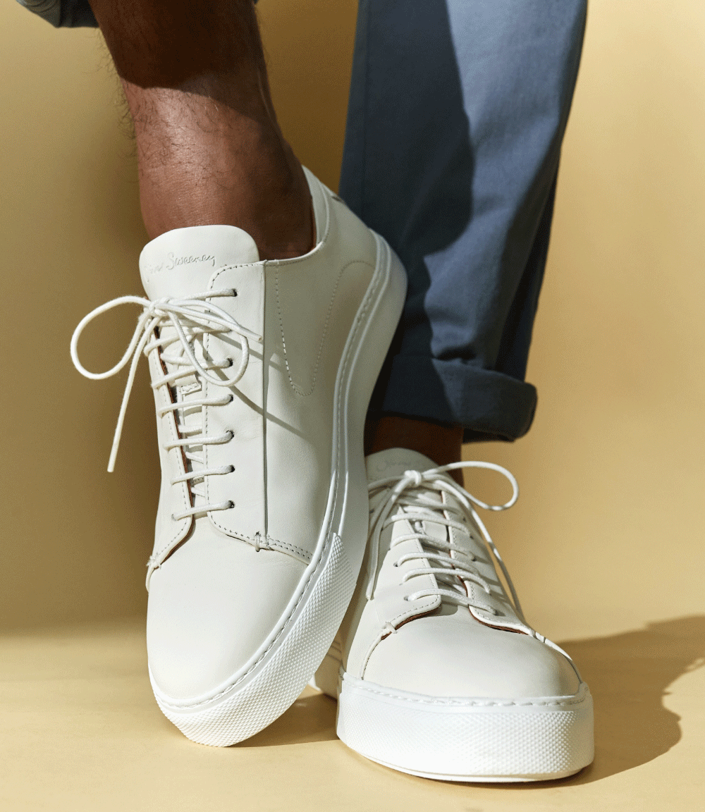 Model wearing Sirolo trainers in white