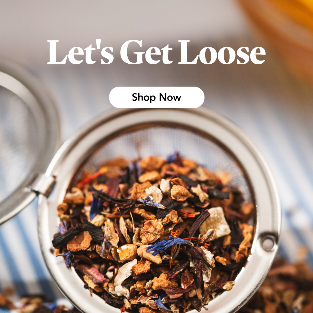 Close up of our loose leaf tea in an infuser with a title that reads "lets get loose"