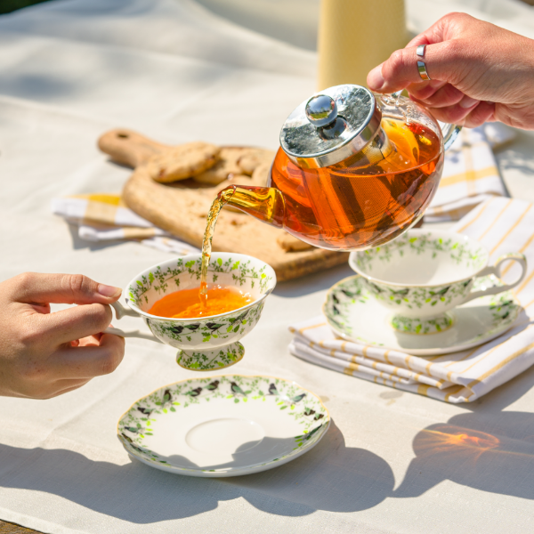 Image of Whittard loose leaf tea being poured from a teapot into a tea discoveries cup