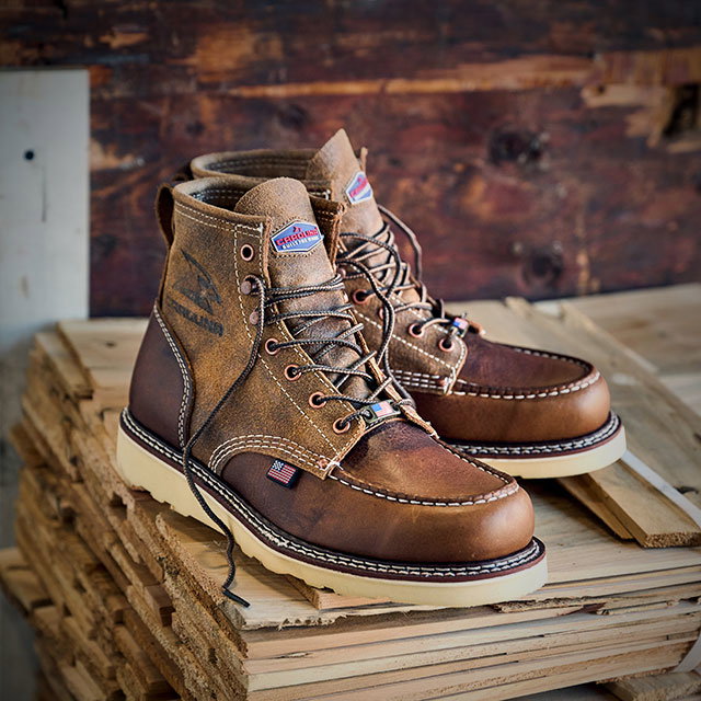 Shop Amp 6" Roughout Steel Toe boot in brown sitting on wood. Shop men's union built boots.