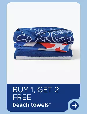 Image of a stack of folded towels. Buy one, get two free beach towels.