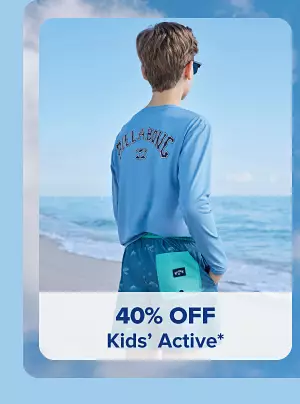 A boy in a Billabong shirt staring at the ocean. 40% off kids' active.