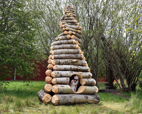 timber twist by ulf mejergren and travis child reimagines larvae shelter as spiraling log cabin