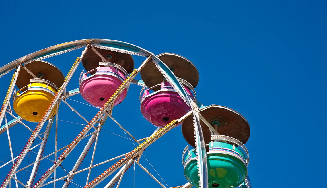 Colorful ferris wheel with blue skies in the background