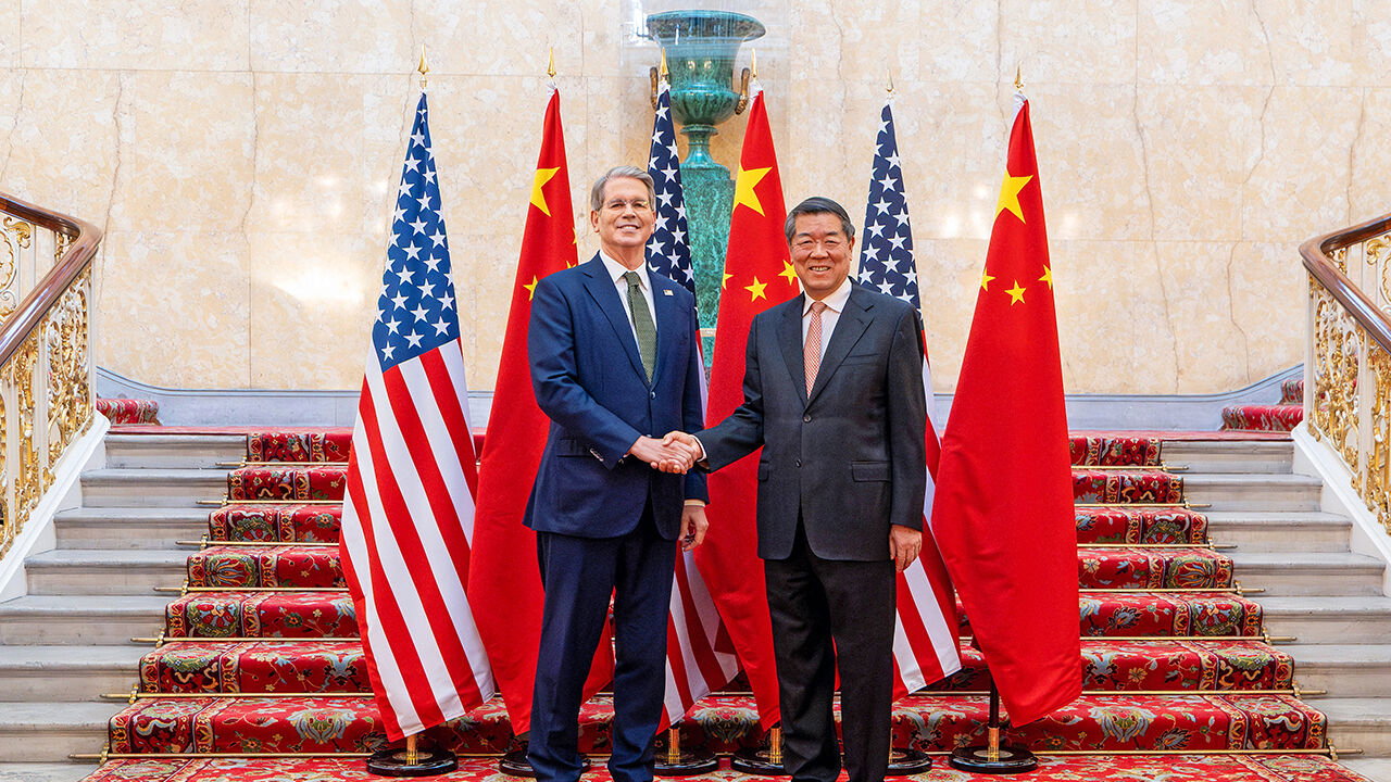 US Secretary of Treasury Scott Bessent and Chinese Vice Premier He Lifeng shake hands as they pose for a photo during trade discussions at the Lancaster House in London, UK.
