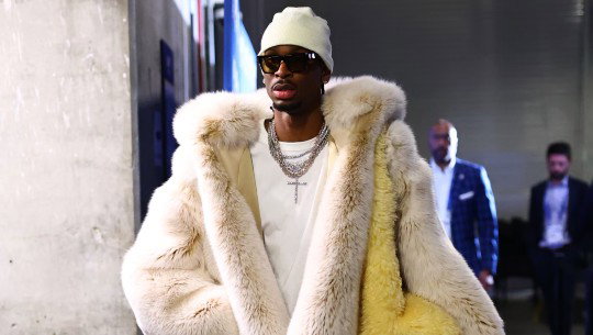 Shai Gilgeous-Alexander wears a voluminous white fur coat