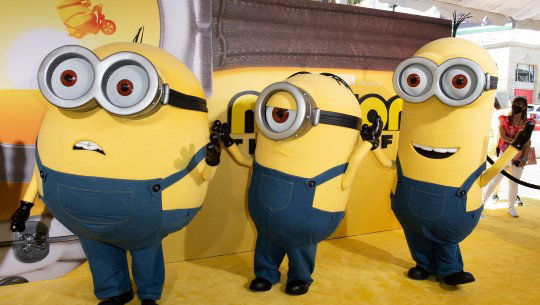 A trio of performers dressed as Minions, the bean-shaped yellow characters from "Despicable Me" movies