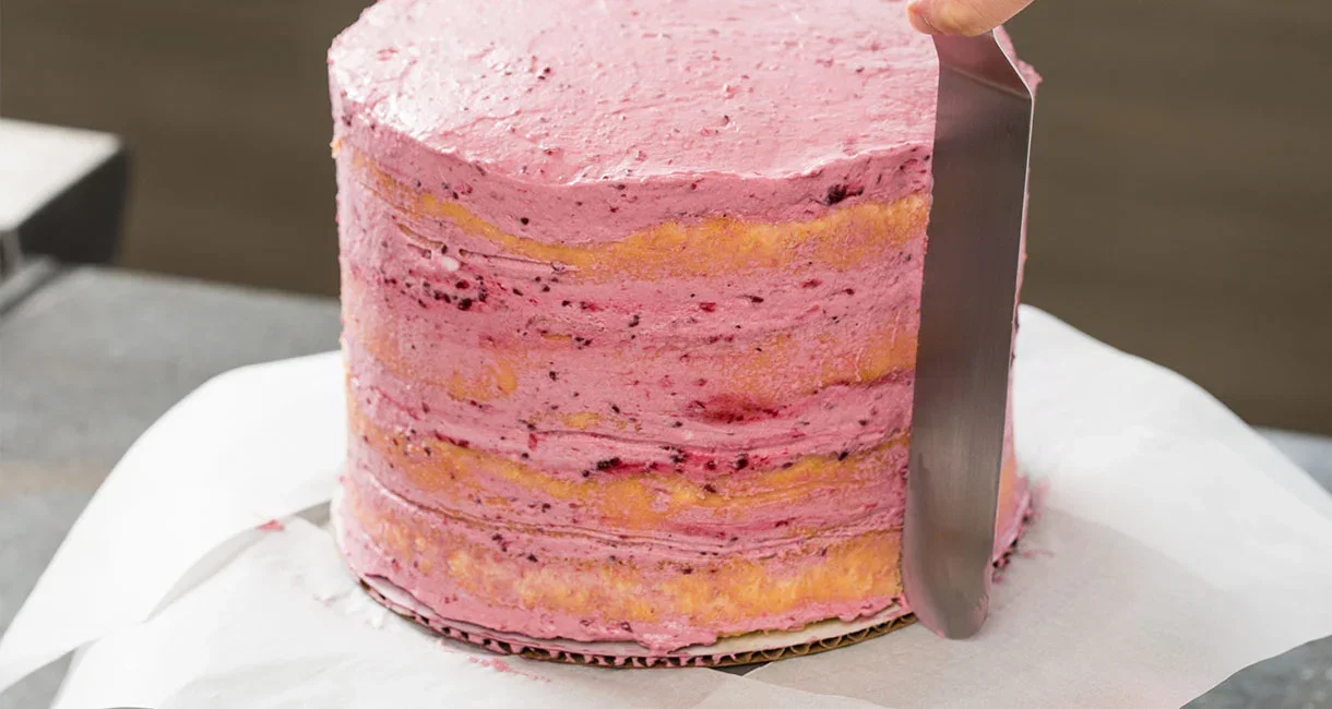 Frosting a naked Blackberry-Mascarpone Lemon Cake