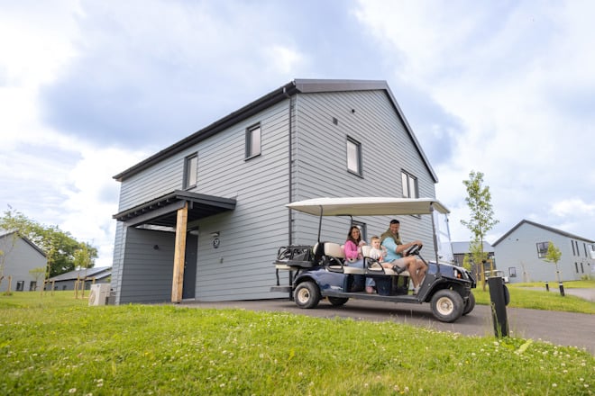 family sat in buggy outside platinum lodge
