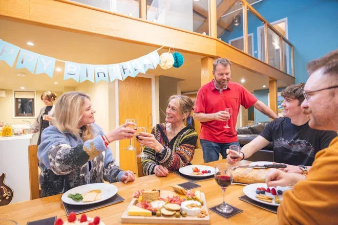 group of friends and family celebrating in bluestone lodge