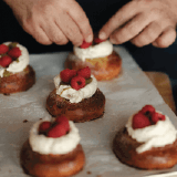 Raspberry topping on pistachio bun