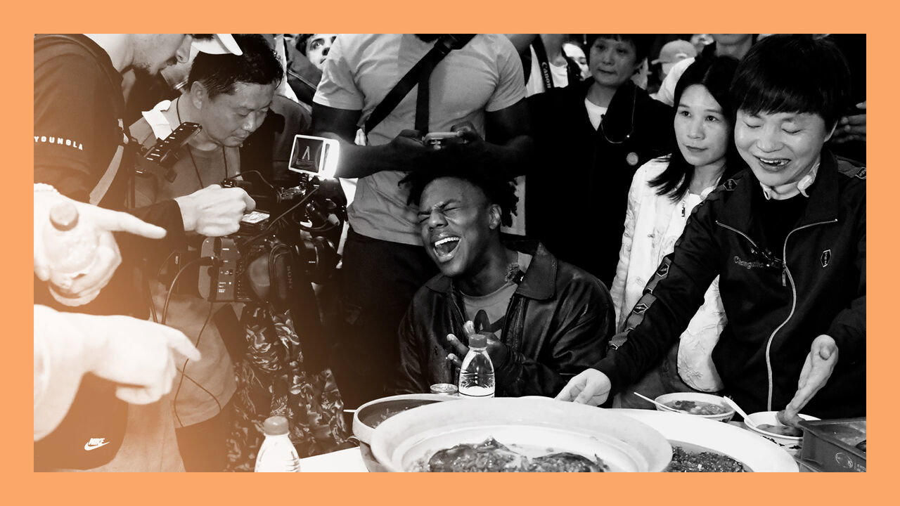 American internet streamer Darren Jason Watkins Jr., also known as IShowSpeed, tastes the local delicacies during the latest stop of his China tour in Changsha, Hunan Province of China.